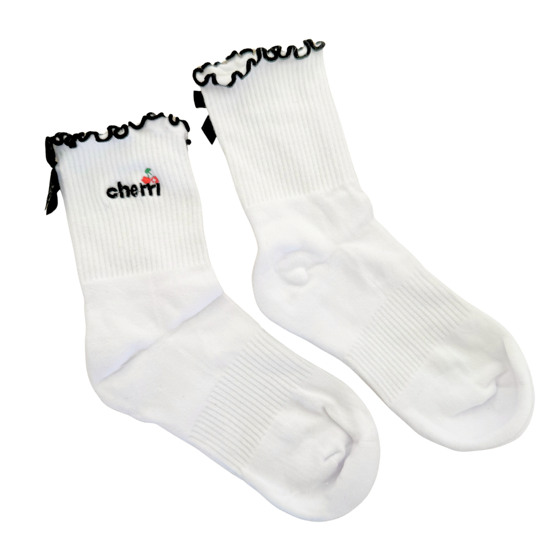 Cherri Ruffle Trim Socks in Buttercream - white crew socks with black ruffled lettuce-trim edge and cherri logo embroidery