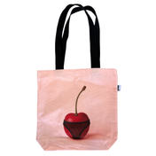 Cherri Tote Bag in pink canvas - angled view showing cherry-in-underwear print with black handles